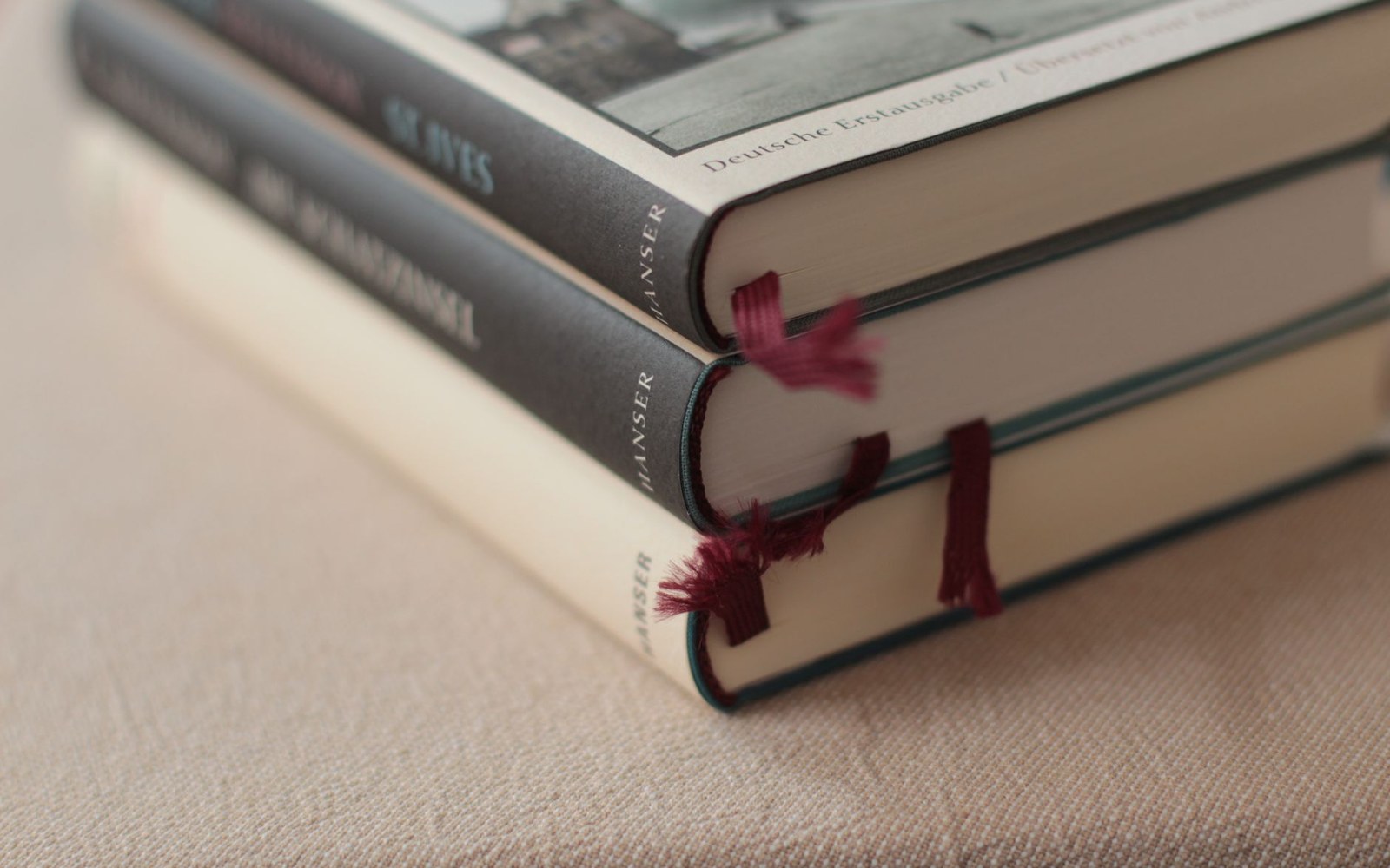 A stack of Novy Mir journals, spines showing issue numbers and years, on a wooden surface in raking light